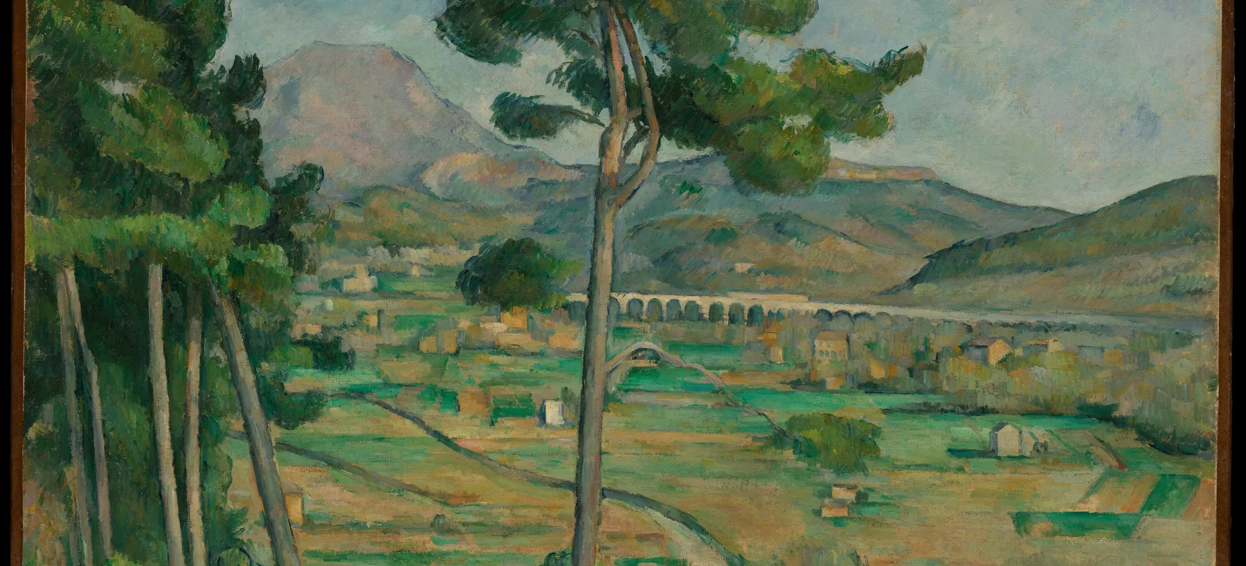 Cezanne: the Arc valley in Provence, fields and vines in a patchwork below Mont Sainte-Victoire.